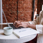 woman typing on computer