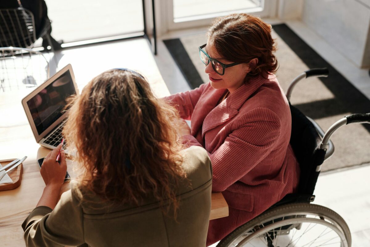 two people sitting at a computer