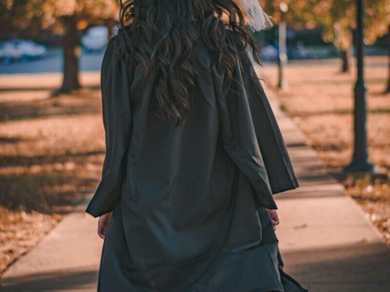 person in cap and gown