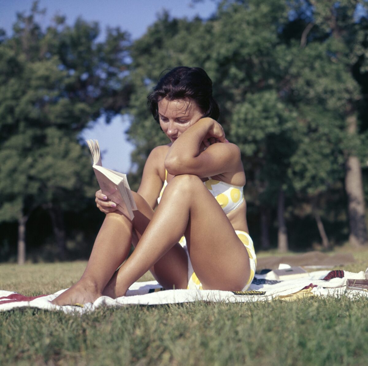 person reading in the sun