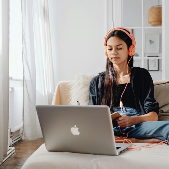 person in front of computer memorizing or listening to something