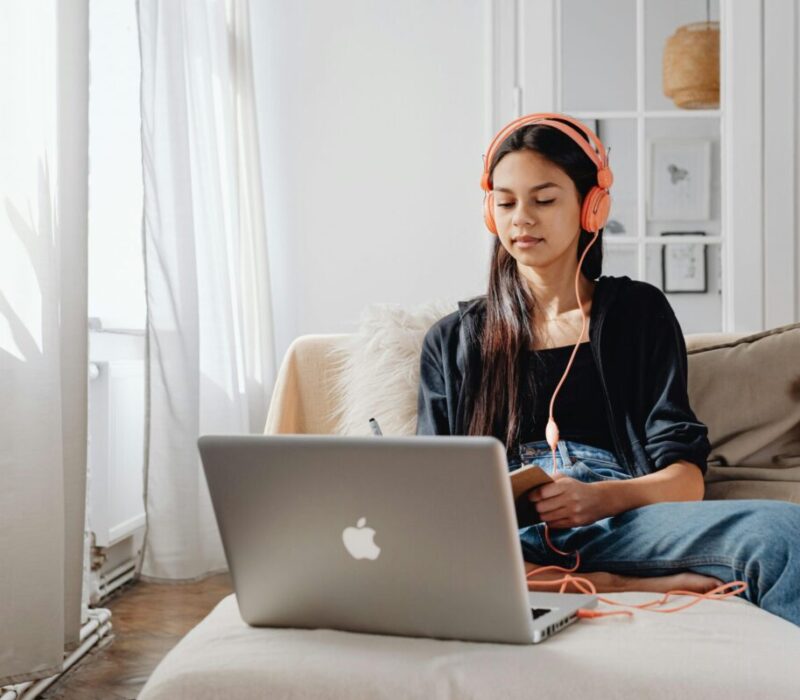 person in front of computer memorizing or listening to something