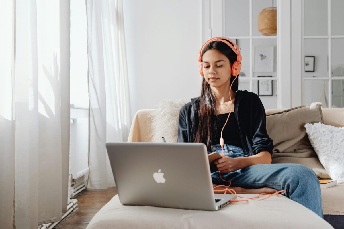 person in front of computer memorizing or listening to something