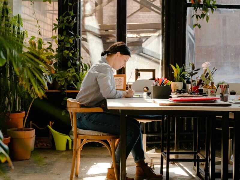 person writing in a studio