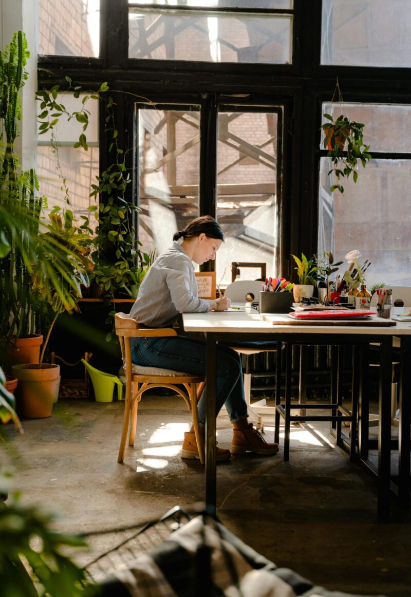 person writing in a studio